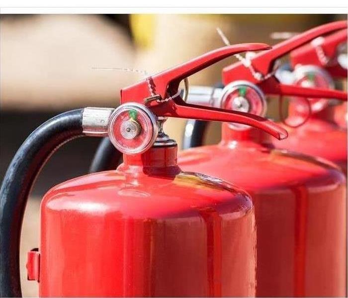 Three tanks of fire extinguishers