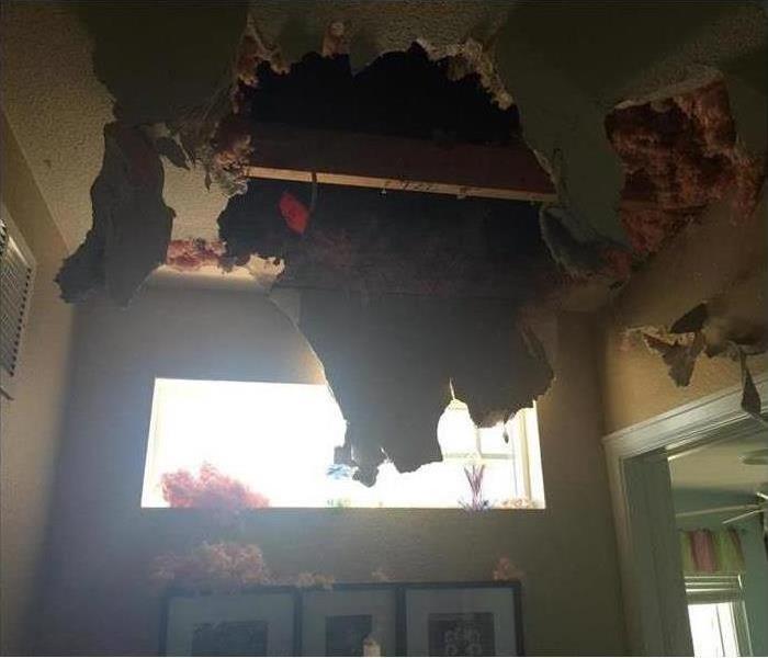 Ceiling collapsed due to fire damage in a home